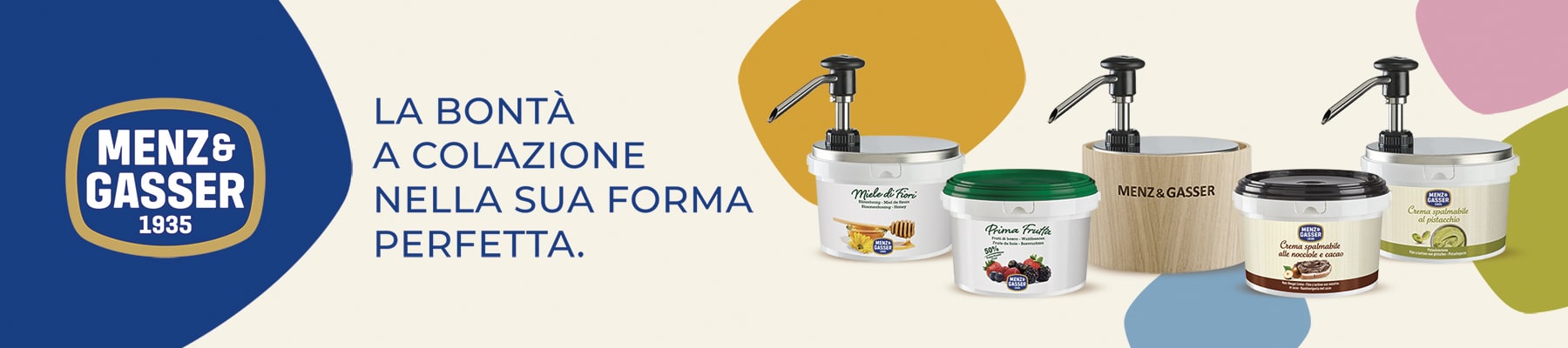 Banner pubblicitario che mostra alla sua sinistra il logo Menz & Gasser su sfondo blu. Alla sua destra, il claim "La bontà a colazione nella sua forma perfetta" affiancato da alcune confezioni del prodotto.
